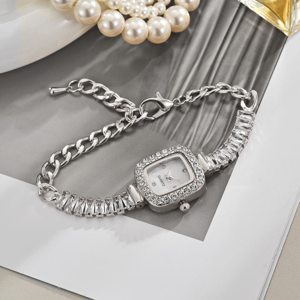 ساعت مچی زنانه بند تنیسی (نقره‌ای)